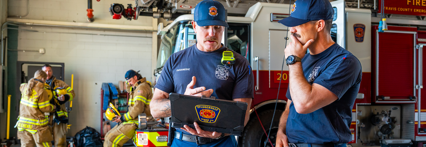Firefighters reviewing data