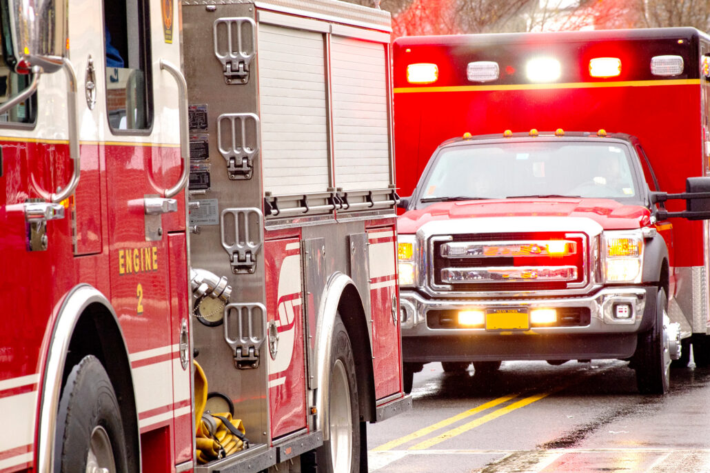 Ambulance and fire truck with lights flashing