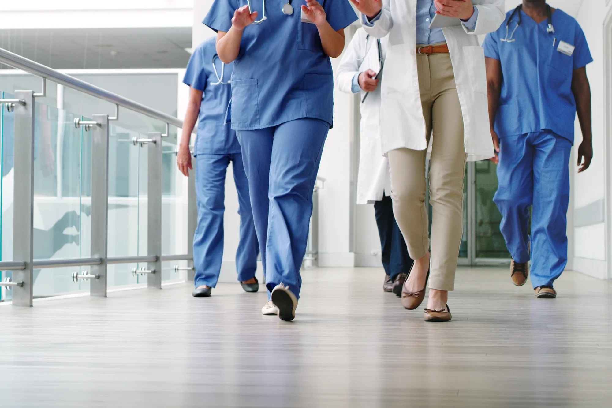 Medical practitioners walking in the hallway of the hospital
