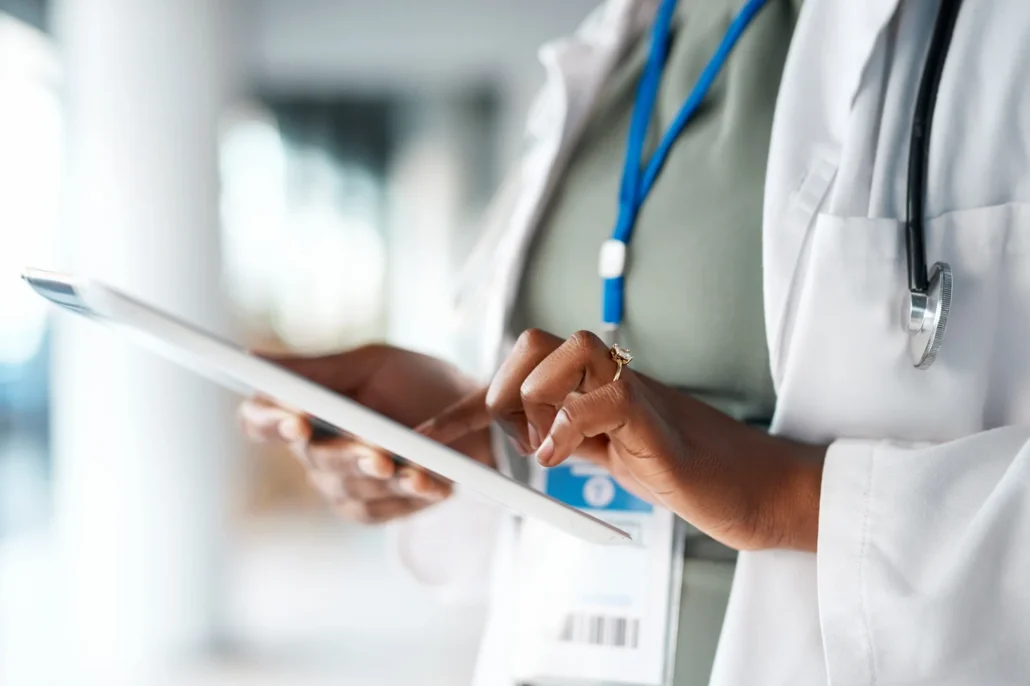 Healthcare, doctor and tablet in hands at hospital