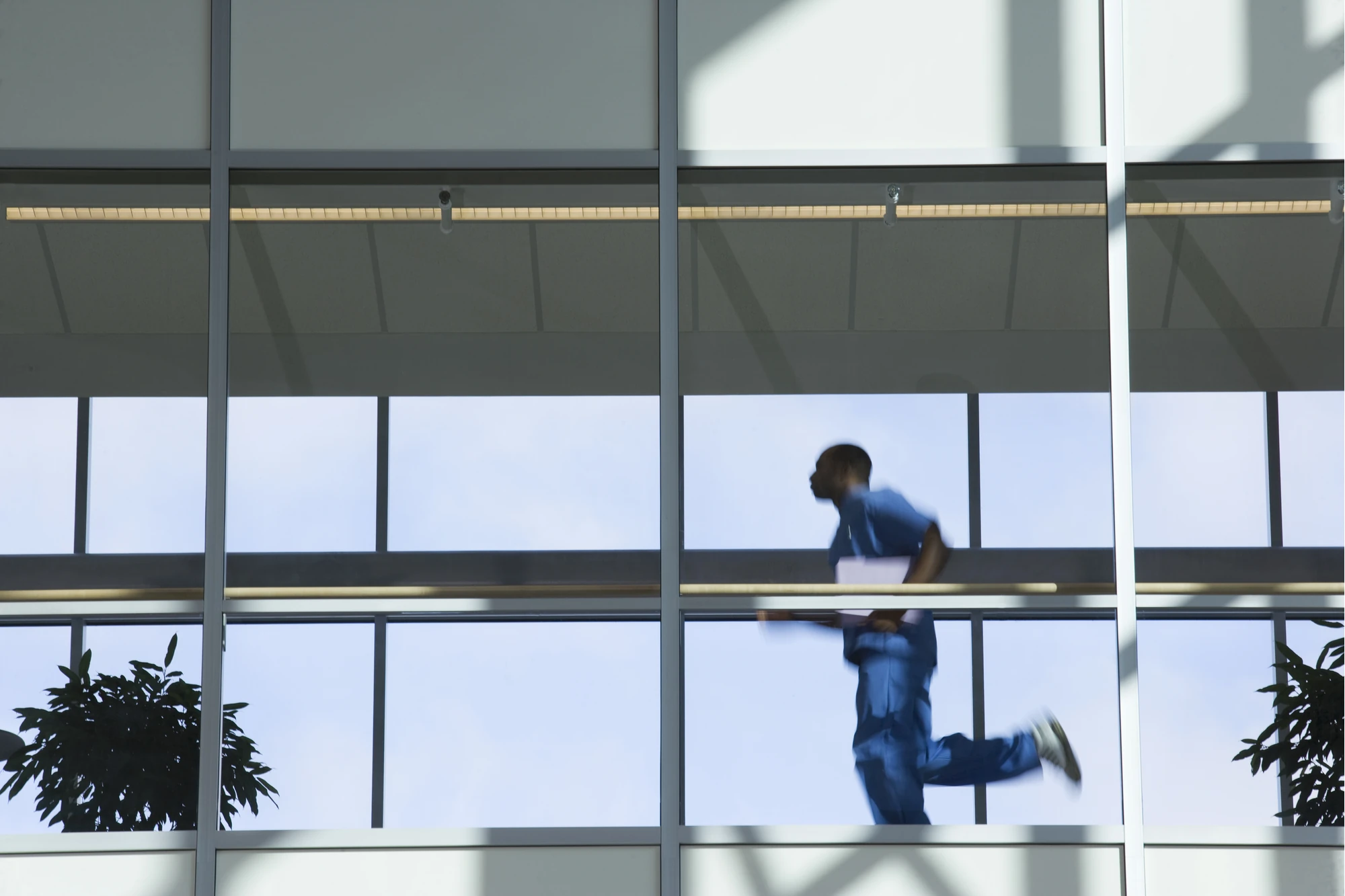 Doctor running down hallway