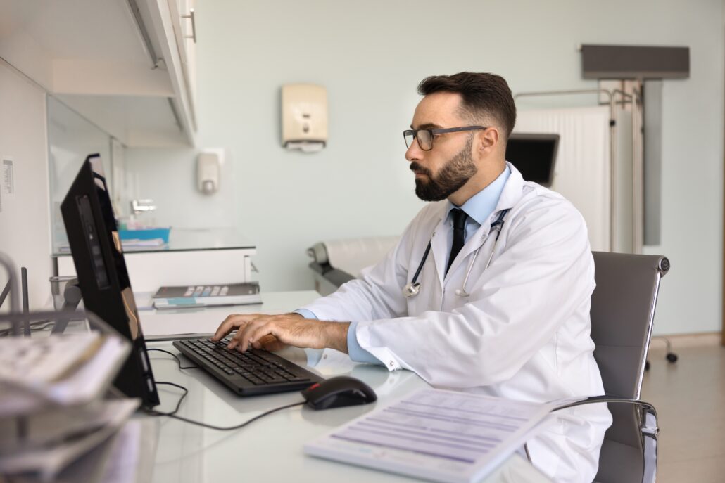 healthcare administrator at computer