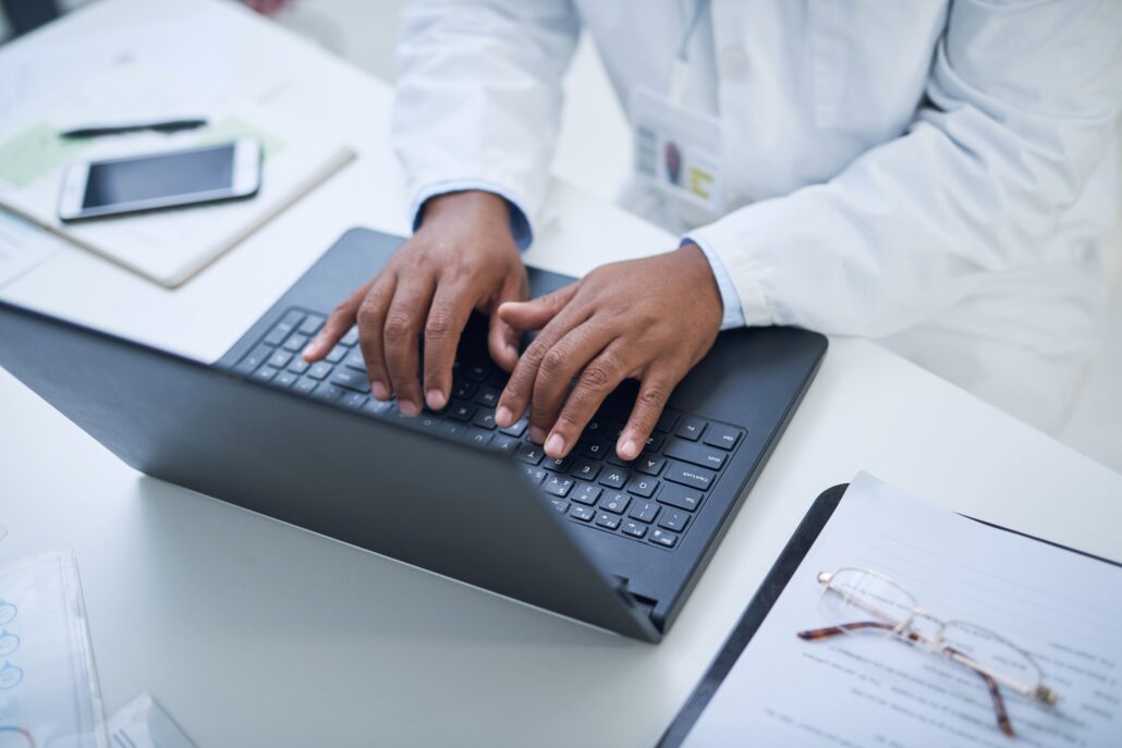 healthcare professional at computer